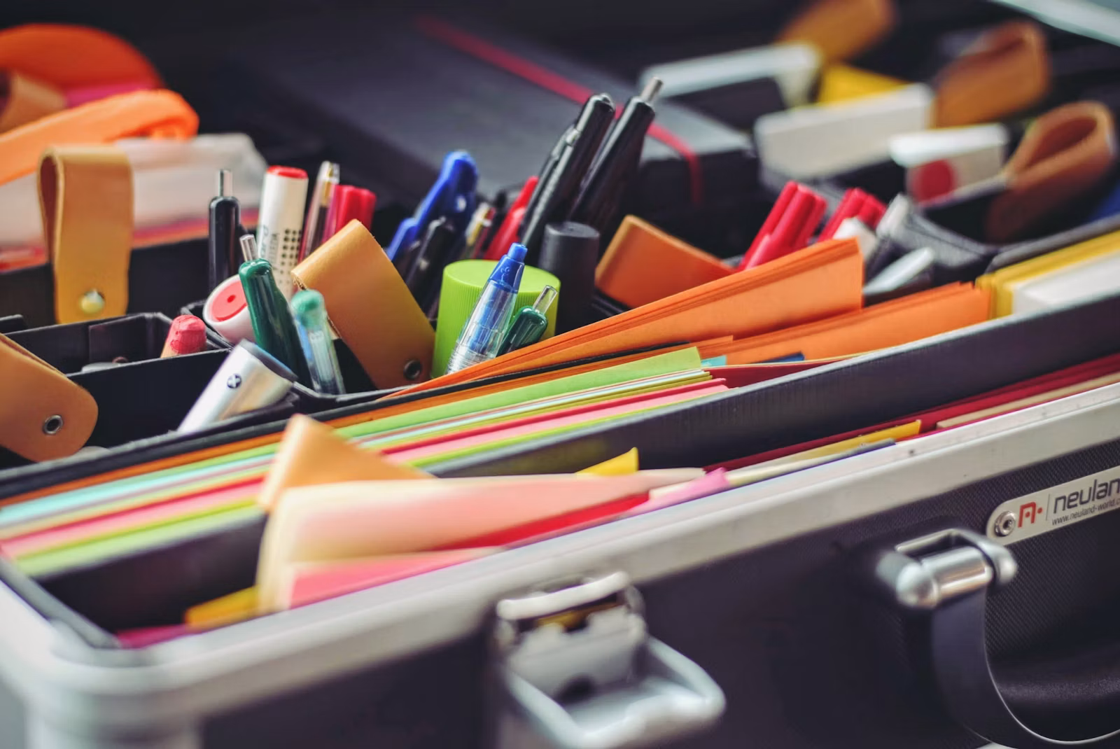 Pens and paper in a stationery case